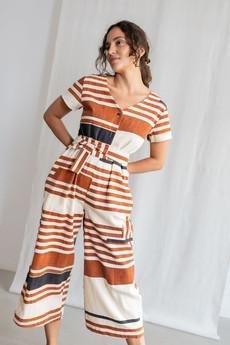 Organic cotton jumpsuit Amrita print terracotta via Jyoti - Fair Works