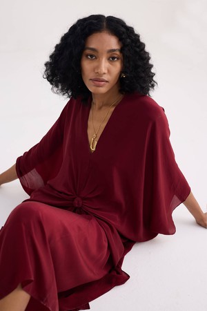 Front Twist Kaftan Dress in Burgundy from Reistor